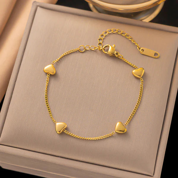 Svarnika Jewels Gold Plated Stainless Steel Anti Tarnish Heart Themed Wraparound Bracelet For Women