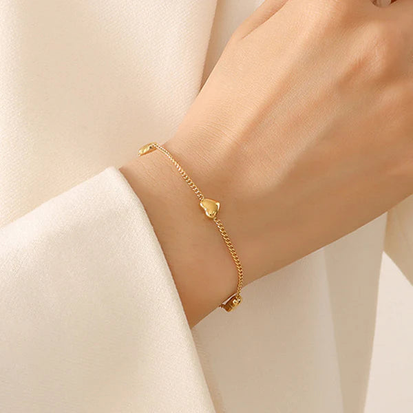 Svarnika Jewels Gold Plated Stainless Steel Anti Tarnish Heart Themed Wraparound Bracelet For Women