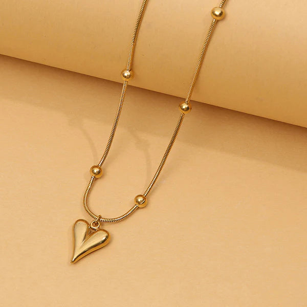 Svarnika Jewels Gold-Plated Anti Tarnish Heart Themed Stainless Steel Pendant