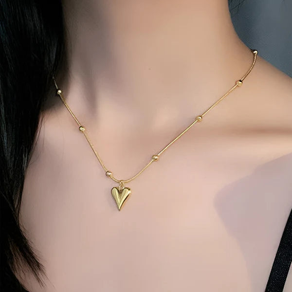 Svarnika Jewels Gold-Plated Anti Tarnish Heart Themed Stainless Steel Pendant