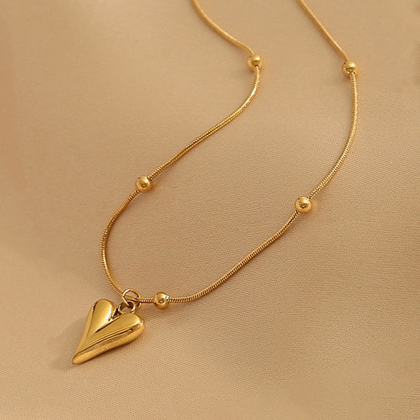 Svarnika Jewels Gold-Plated Anti Tarnish Heart Themed Stainless Steel Pendant