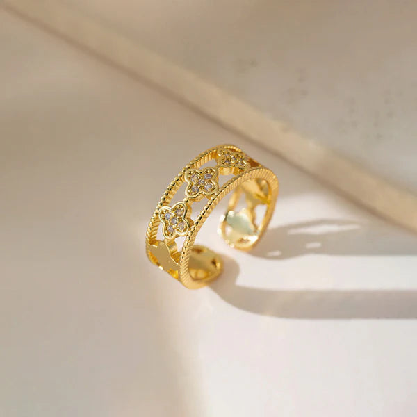 Svarnika Jewels Gold Plated Anti Tarnish Stainless Steel Clover Themed Adjustable Finger Ring