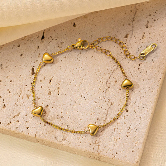 Svarnika Jewels Gold Plated Stainless Steel Anti Tarnish Heart Themed Wraparound Bracelet For Women