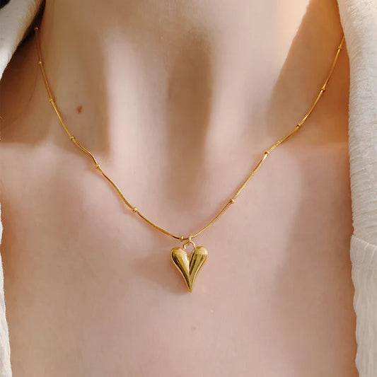 Svarnika Jewels Gold-Plated Anti Tarnish Heart Themed Stainless Steel Pendant