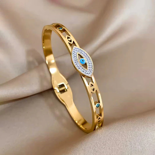 Svarnika Jewels Gold Plated Stainless Steel Evil Eye Themed Anti Tarnish Bangle Style Bracelet
